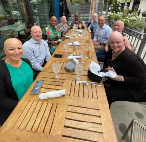 a group of people with alopecia areata dining together