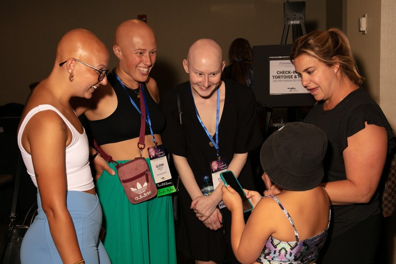 A group of people with alopecia areata meeting at the NAAF conference