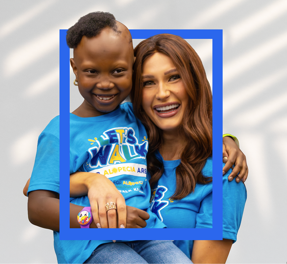 Two people embracing at an alopecia awareness walk